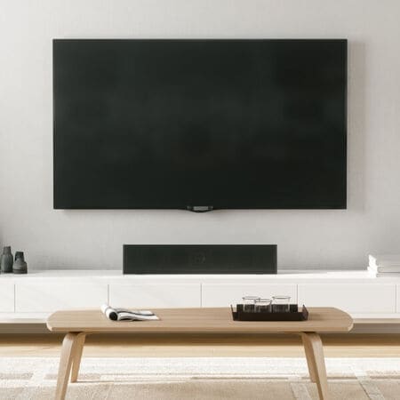 Mounted TV, soundbar, TV Stand and Wooden Coffee Table